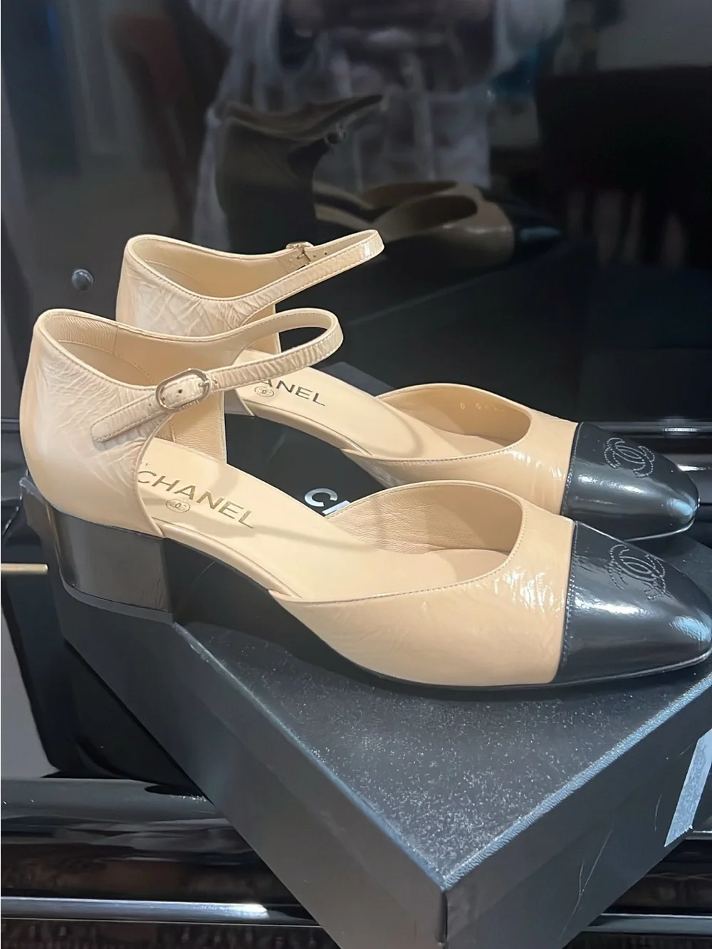 CHANEL Beige and Black Cap-Toe Slingback Heels